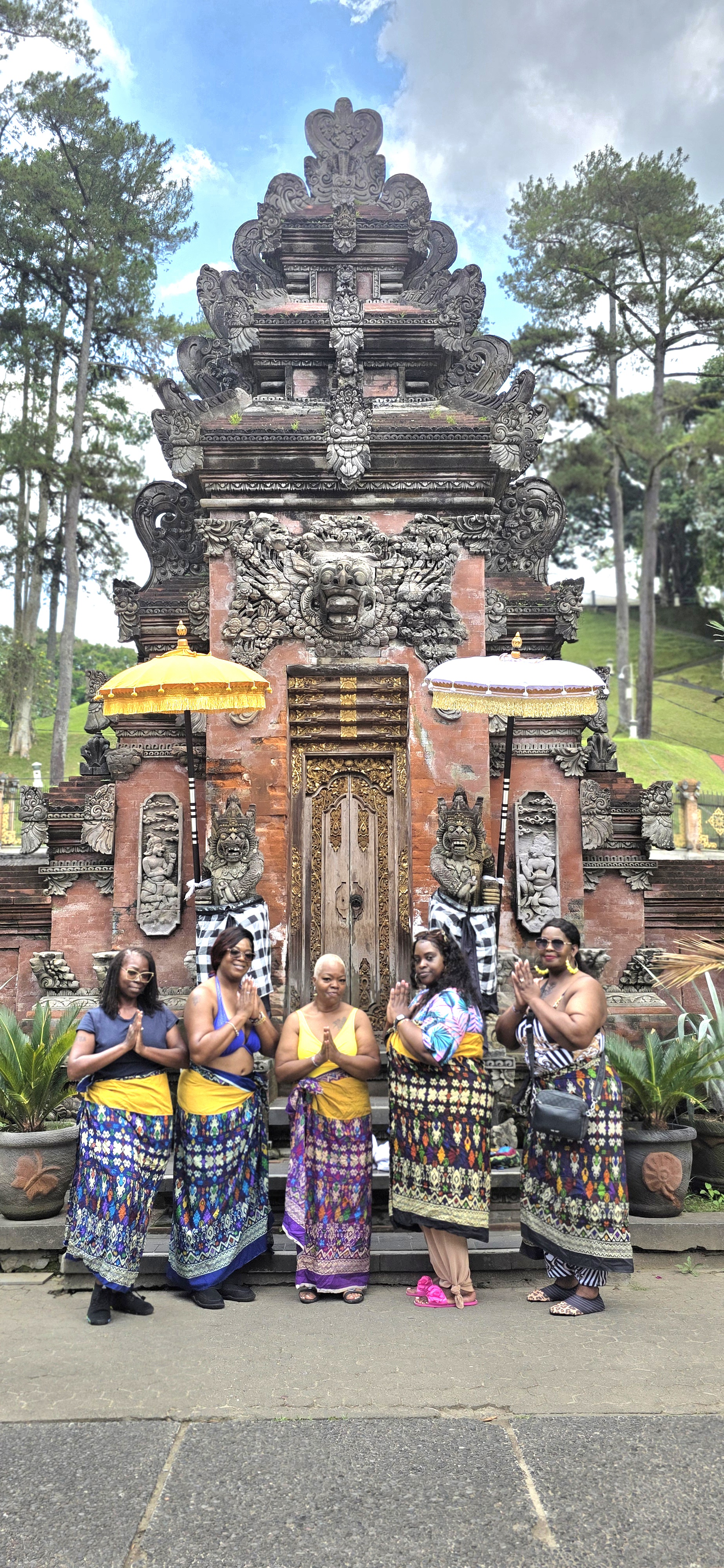Group photo on temple steps at night in Bali